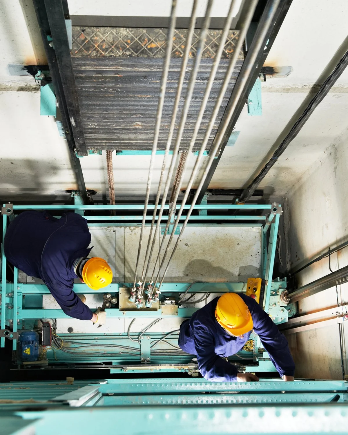 Elevator mechanic in hoistway