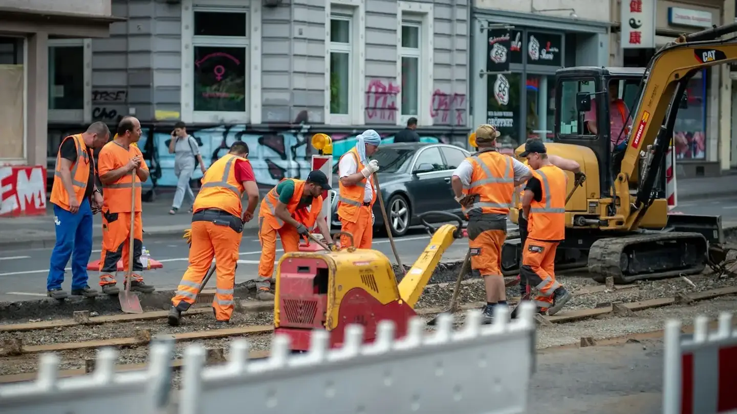 A council works crew and plant on a city street